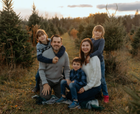 Carson family photo amongst fir trees